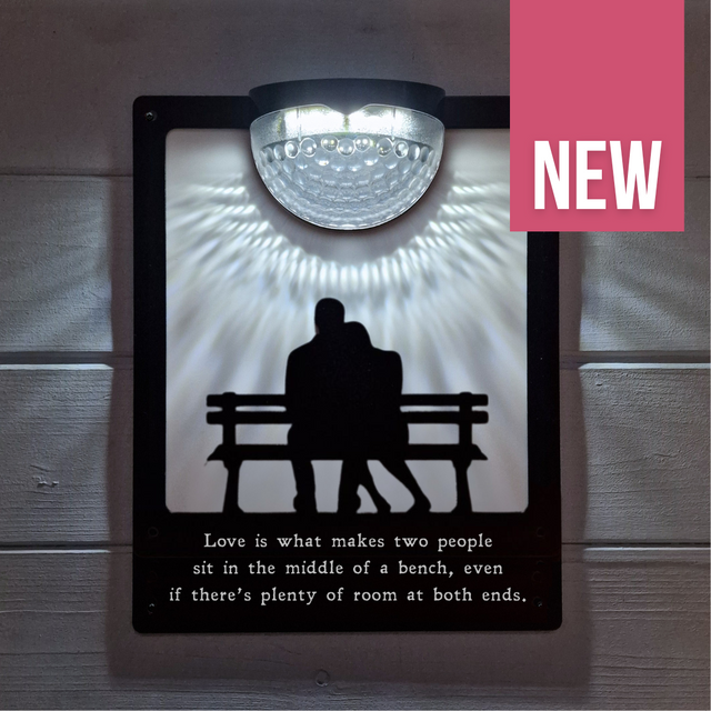 'Love is what makes two people...' Couple on Bench Solar Light Wall Plaque